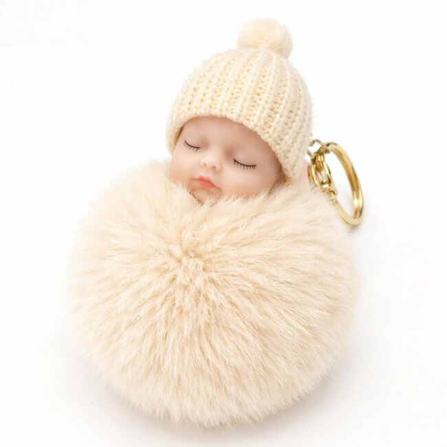 Schl&uuml;sselanh&auml;nger schlafendes Baby mit Fellbommel 12cm creme