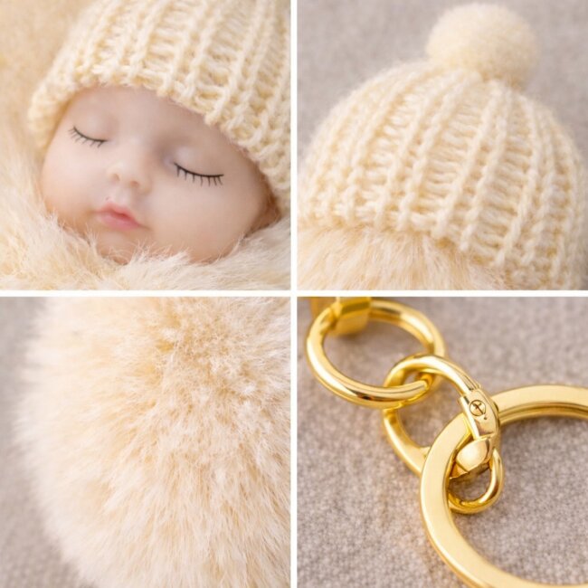Schl&uuml;sselanh&auml;nger schlafendes Baby mit Fellbommel 12cm creme